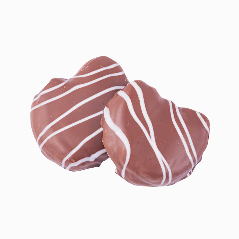 Dos Hojaldre con forma de palmera con crema de avellana cubierto de cobertura negra y decorado con cobertura blanca